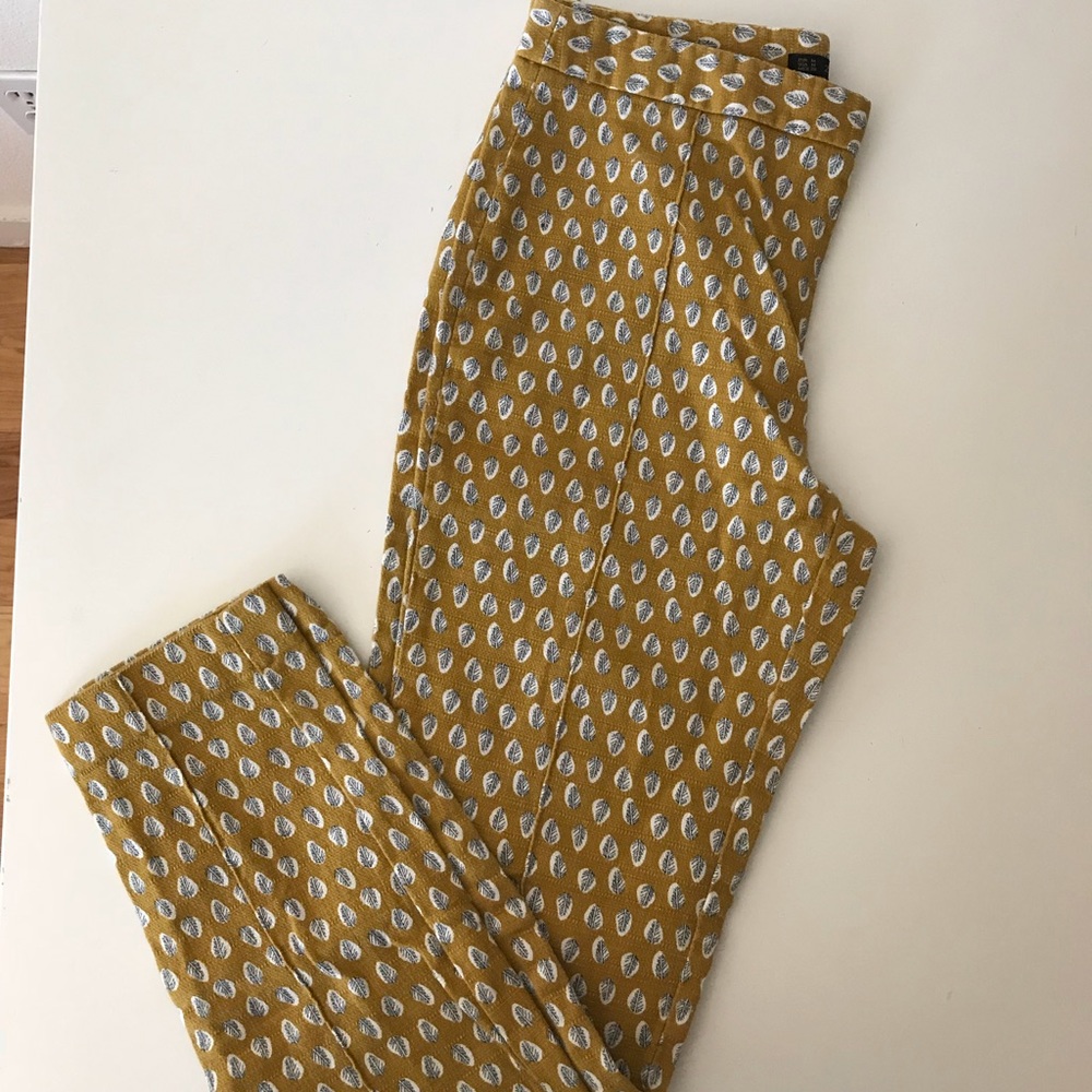 Zara yellow pants with white and black leaf print.